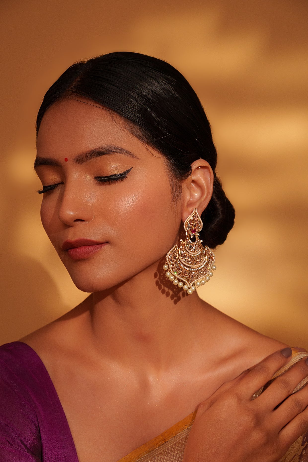 Festive Gold Chandbali Earrings with Kundan and Pearl Accents