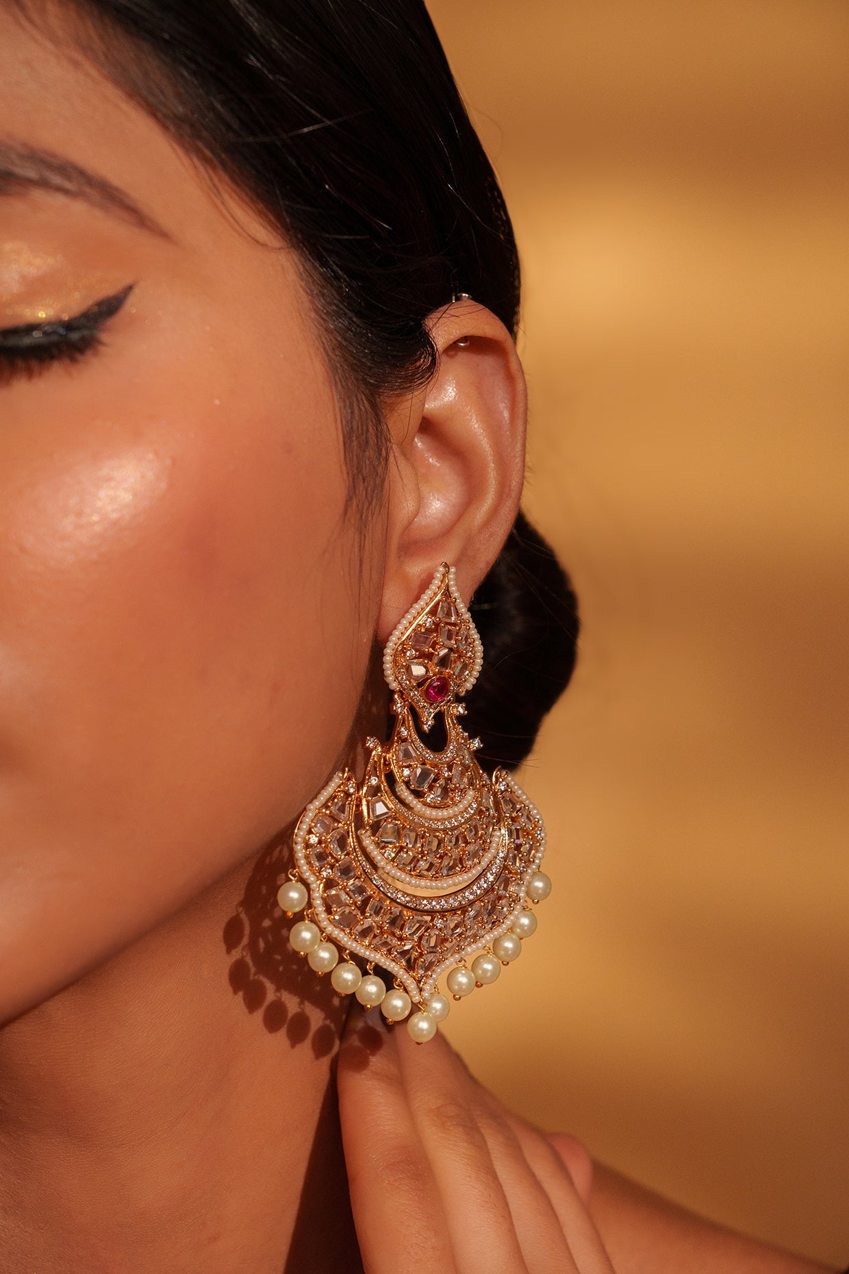 Festive Gold Chandbali Earrings with Kundan and Pearl Accents